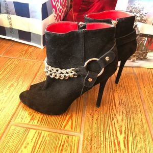 Amazing heeled booties with red interior!